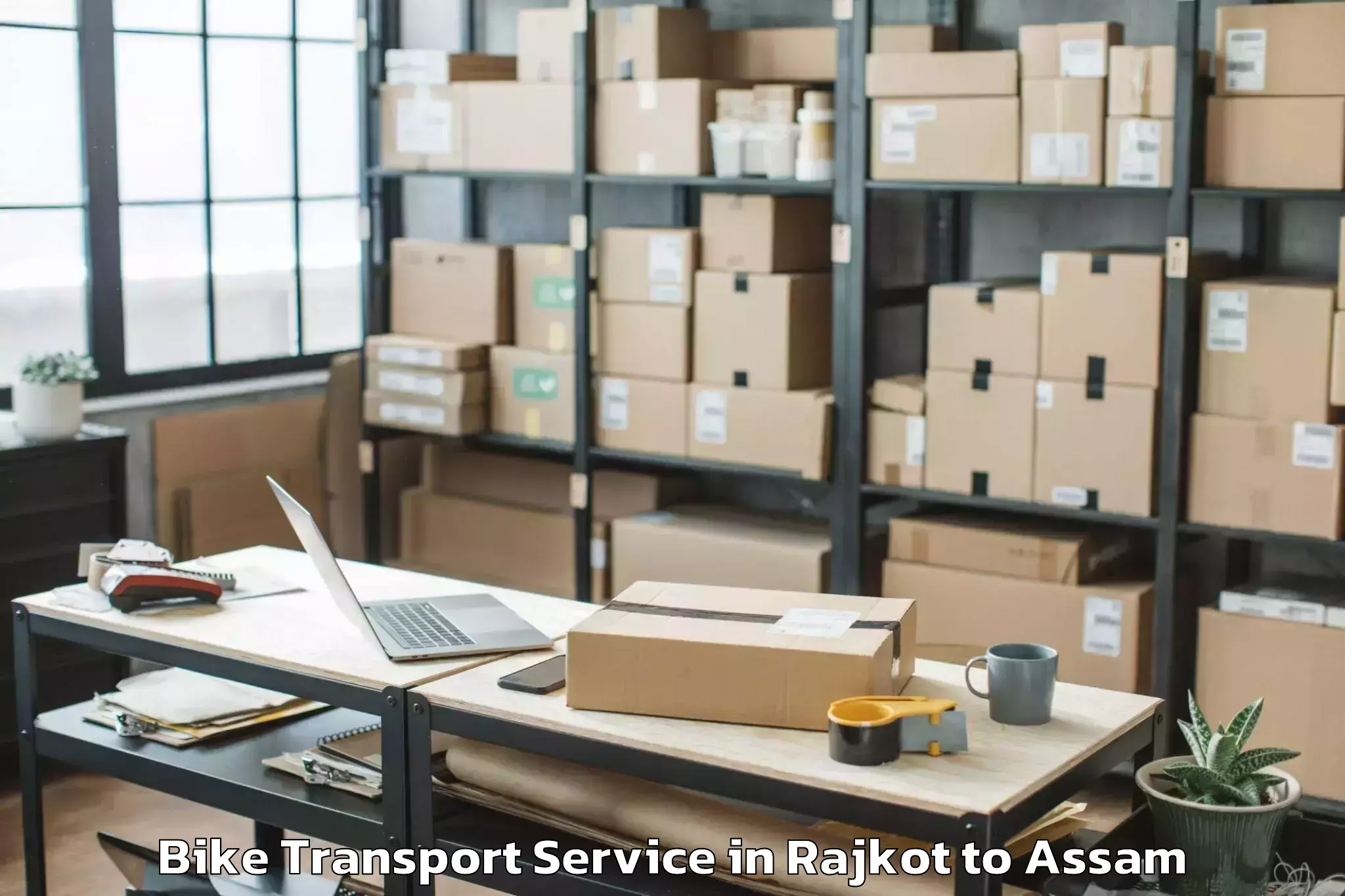 Leading Rajkot to Jorhat West Bike Transport Provider